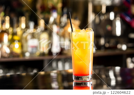 Tequila sunruse cocktail at bar counter background. Tequila sunruse cocktail at bar counter background. 122604622