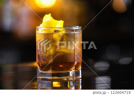 Closeup image of glass of rum and cola cocktail at bright blurred background. 122604719
