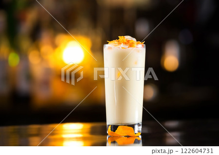 Closeup glass of pina colada cocktail at bright bar counter background. 122604731