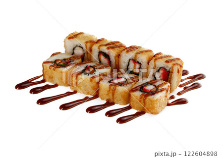 Closeup image of deep fried tempura rolls served with teriyaki sauce isolated at white background. 122604898