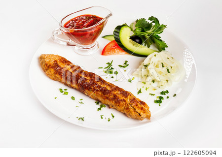 National meal chicken shish kebab with sauce isolated at white background. 122605094