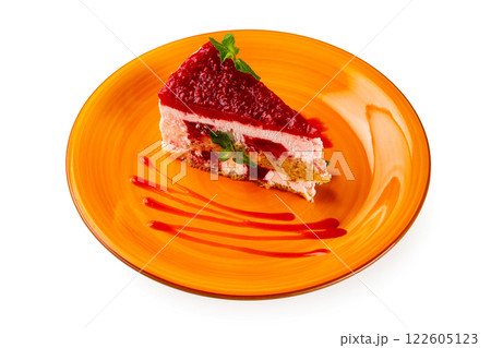 Closeup piece of strawberry cake served at a plate isolated at white background. Closeup piece of strawberry cake served at a plate isolated at white background. 122605123