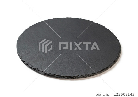 Round stone black plate for food serving isolated at white background. 122605143