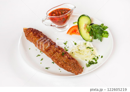 National meal beef shish kebab with sauce isolated at white background. 122605219