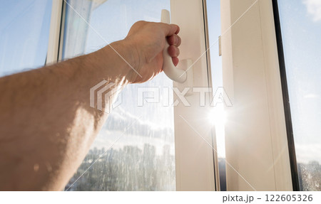 Man open white window Man open white window 122605326