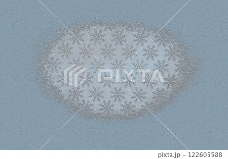 A relief pattern of snowflakes on a rough blue surface 122605588