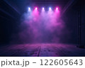 A dark, futuristic space illuminated by vibrant pink and purple lights with hazy fog 122605643