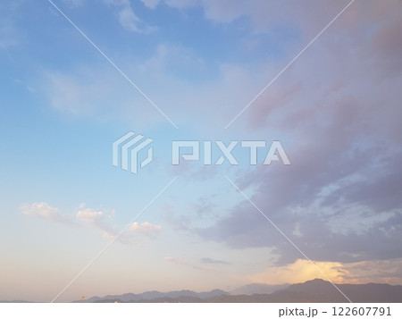 Pastel colour sky, dawn background. Blue sky with clouds and sun light 122607791