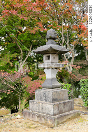 Japanese stone lantern in the garden, beautiful Autumn scenery in Japan. Japanese stone lantern in the garden, beautiful Autumn scenery in Japan. 122608056