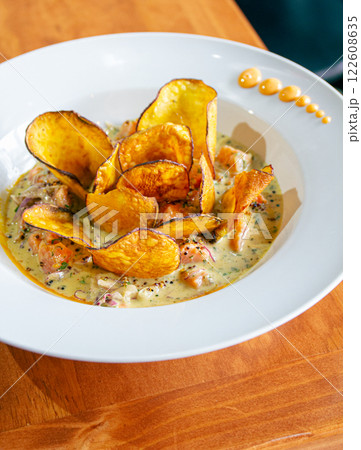 PERUVIAN CEVICHE SEBICHE. Peruvian seafood and fish sebiche with maize and potato sweet crips 122608635