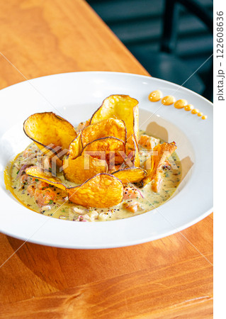 PERUVIAN CEVICHE SEBICHE. Peruvian seafood and fish sebiche with maize and potato sweet crips 122608636