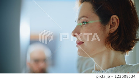 Airport Terminal: Close Up of Passengers Walking Through X-ray Metal Detector Scanner Gates 122609534