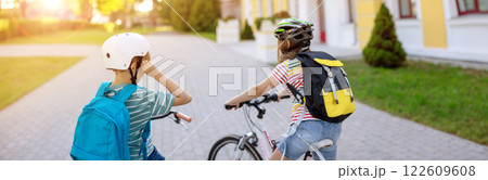 Boy and girl on the bicycles riding together. Boy and girl on the bicycles riding together. 122609608