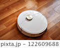 Robot vacuum cleaner cleans the apartment 122609688