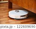 Robot vacuum cleaner cleans the apartment 122609690