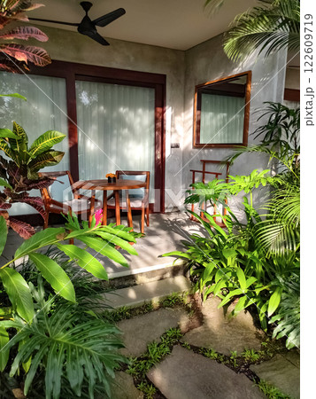 View of the terrace in abstract Ubud resort with summer garden 122609719