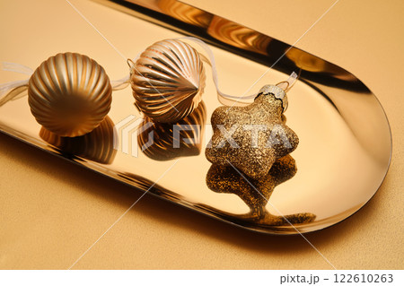 Christmas tree toys on a golden tray. 122610263