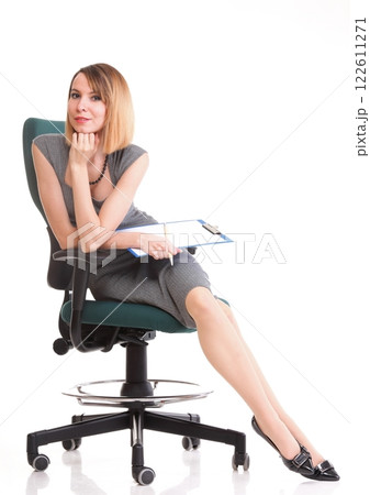 young business woman sitting with her clipboard isolated 122611271