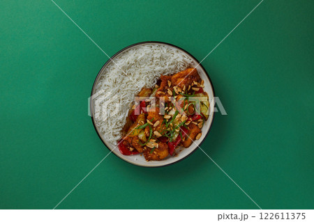 top shot on blue background black salad plate with Chinese rice and cabbage kim chi asian cuisine healthy eating 122611375