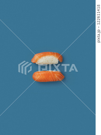top shot on a blue background lies a set with two sashimi with sea red salmon fish professional serving of Japanese cuisine top shot on a blue background lies freshly caught seafood chef's skill top shot on a blue background lies a set with two sashimi with sea red salmon fish professional serving of Japanese cuisine top shot on a blue background lies freshly caught seafood chef's skill 122611418