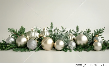 Decorative arrangement of ornaments and greenery on a light background 122611719