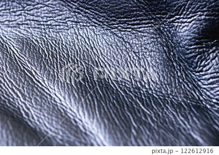 A CloseUp View of a Textured Dark Leather Surface Showcasing Its Rich Detail and Quality 122612916