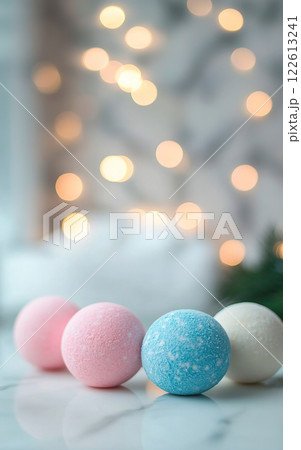 Displaying an Array of Colorful Bath Bombs Against a Serene Background with Ambient Lights 122613241