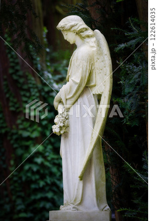 white angel sculpture in a cemetery 122614035
