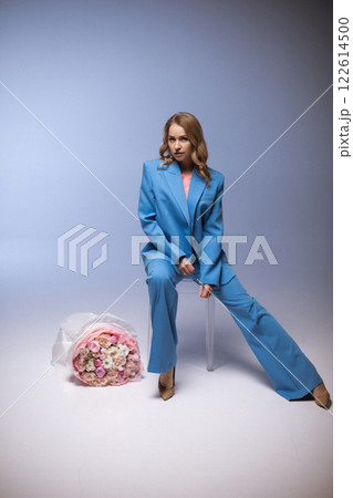 Beautiful stylish woman in a blue suit with 122614500