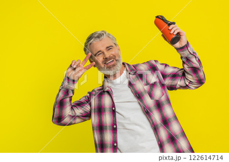 Happy man dancing with portable speaker, joyful freedom, musical expression groove, listening music Happy man dancing with portable speaker, joyful freedom, musical expression groove, listening music 122614714
