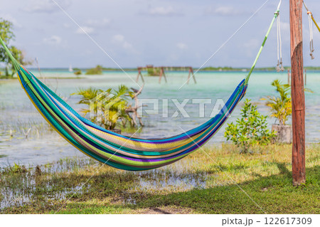Turquoise waters of Bacalar Lake, Mexico. Peaceful and scenic tropical destination. Travel, relaxation, and nature concept 122617309