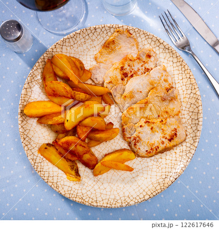 Fried barbecue pork meat with baked potato 122617646