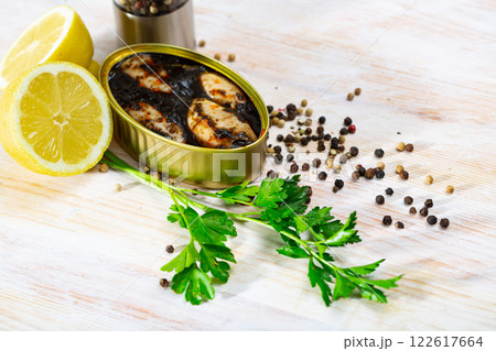 Marinated chipirones in ink with greens and lemon 122617664