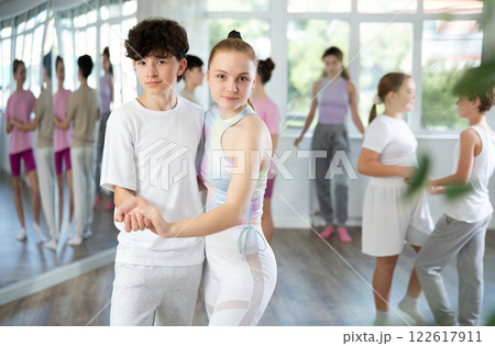 Teenage boy and girl dancing waltz 122617911
