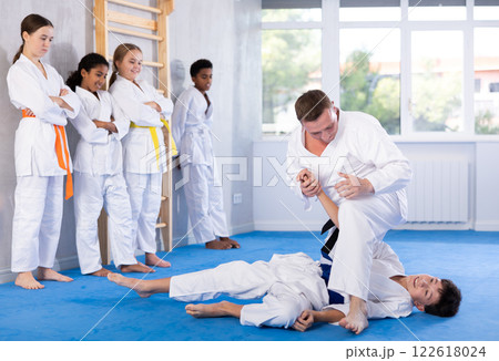 Coach and boy training judo technique Coach and boy training judo technique 122618024