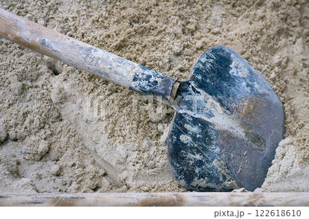 Shovel in a pile of sand at a construction site 122618610