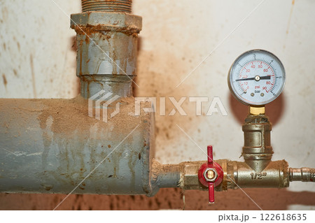 Pressure sensor, meter and faucet on the water pipe in the basement 122618635