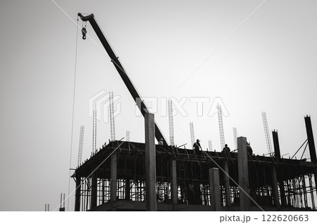 Construction site, Tower Cranes on Residential buildings Construction, Construction of Multi Storey Residential Building, Tower Crane on formworks, Construction of Skyscrapers, Black and white picture Construction site, Tower Cranes on Residential buildings Construction, Construction of Multi Storey Residential Building, Tower Crane on formworks, Construction of Skyscrapers, Black and white picture 122620663