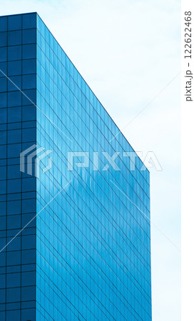 Minimalist Reflection. A sleek, geometric facade capturing the essence of simplicity and modernity through sharp angles and serene reflections on a glassy surface. Minimalist Reflection. A sleek, geometric facade capturing the essence of simplicity and modernity through sharp angles and serene reflections on a glassy surface. 122622468