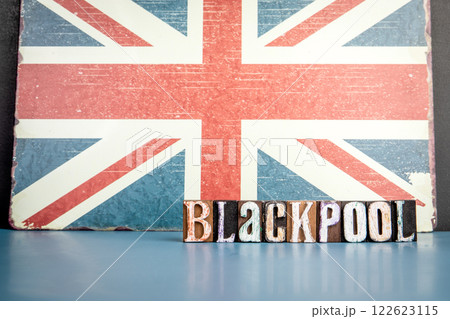 BLACKPOOL. Urban Area in Great Britain. Flag and alphabet letters on wooden texture background 122623115