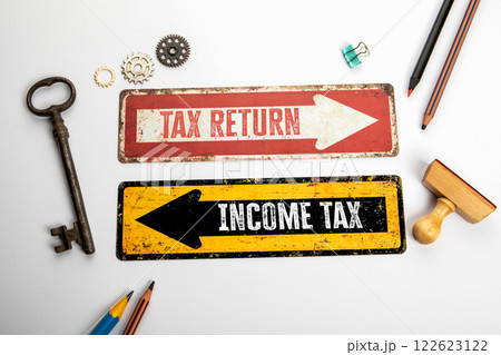 Tax return and Income tax. Red and yellow directional arrow with text 122623122
