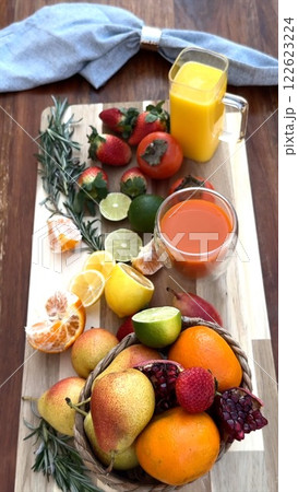 Bright eco fruits arranged with citrus highlights create vibrant seasonal display. Eco citrus, organic oranges, and fresh fruits celebrate natural freshness and seasonal eco harmony. 122623224
