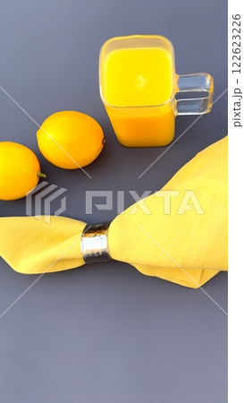 Fresh lemons exude beauty, fruit captures vitality and energy, lemons enhance organic appeal, fruit inspires wellness visuals, yellow napkin adds elegance, and lemons promote modern health concepts. 122623226