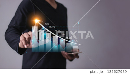 Young man with smartphone mobile hand hold a pen touching to visualize money growth  122627989