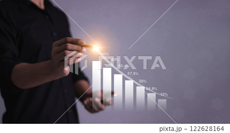 Young man with smartphone mobile hand hold a pen touching to visualize money growth  122628164