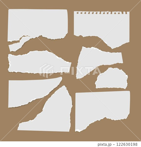 Torn paper sheets set on brown background 122630198