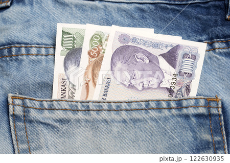 Old Turkish Lira in the pocket of blue jeans Old Turkish Lira in the pocket of blue jeans 122630935