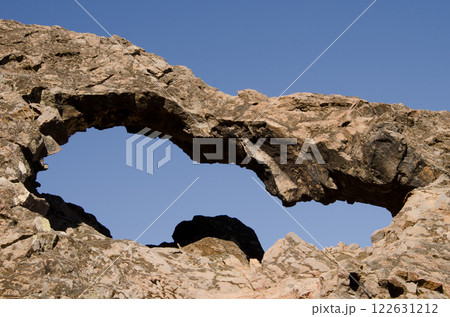 Rock forming a natural arch. 122631212