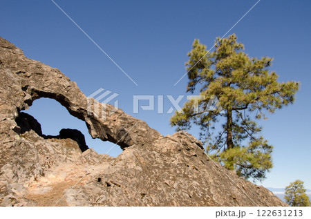 Rock forming a natural arch. 122631213