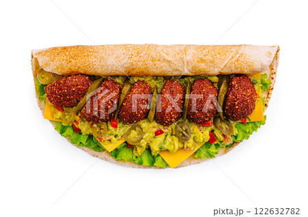 Delicious falafel wrap filled with fresh ingredients and colorful toppings 122632782